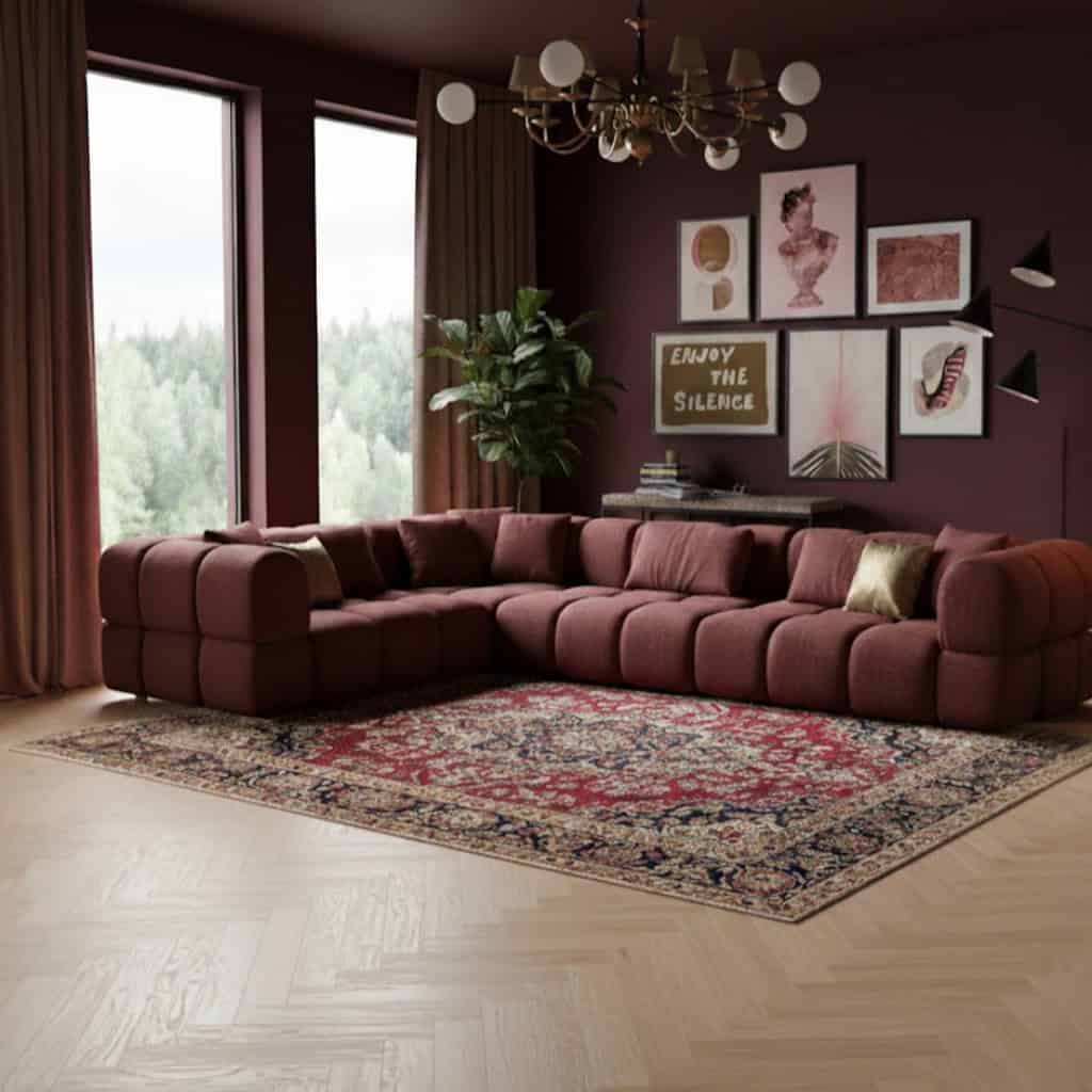 Luxe Mokana Parkaway lounge bank van Primavera in een elegante woonkamer met robuusterrode wanden en stijlvolle decoratie, perfect voor moderne en designmeubels.