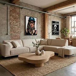 Romantische beige Mokana bank met natuurlijk houten tafel en planten in industrieel interieur met bakstenen muur en grote ramen voor stijlvolle woonkamer.