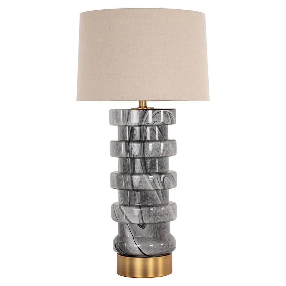 Elegante marmeren tafellamp met een beige stoffen kap, perfecte verlichting voor een modern interieur.