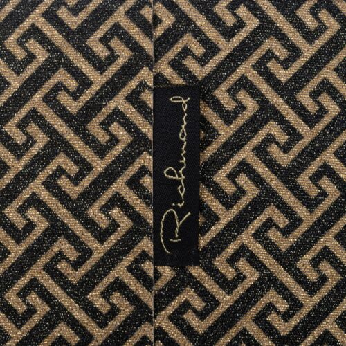 Luxueus meubelstof met goudkleurige geometrische patroon en glinsterende details, perfect voor elegante meubels en interieurdesign.