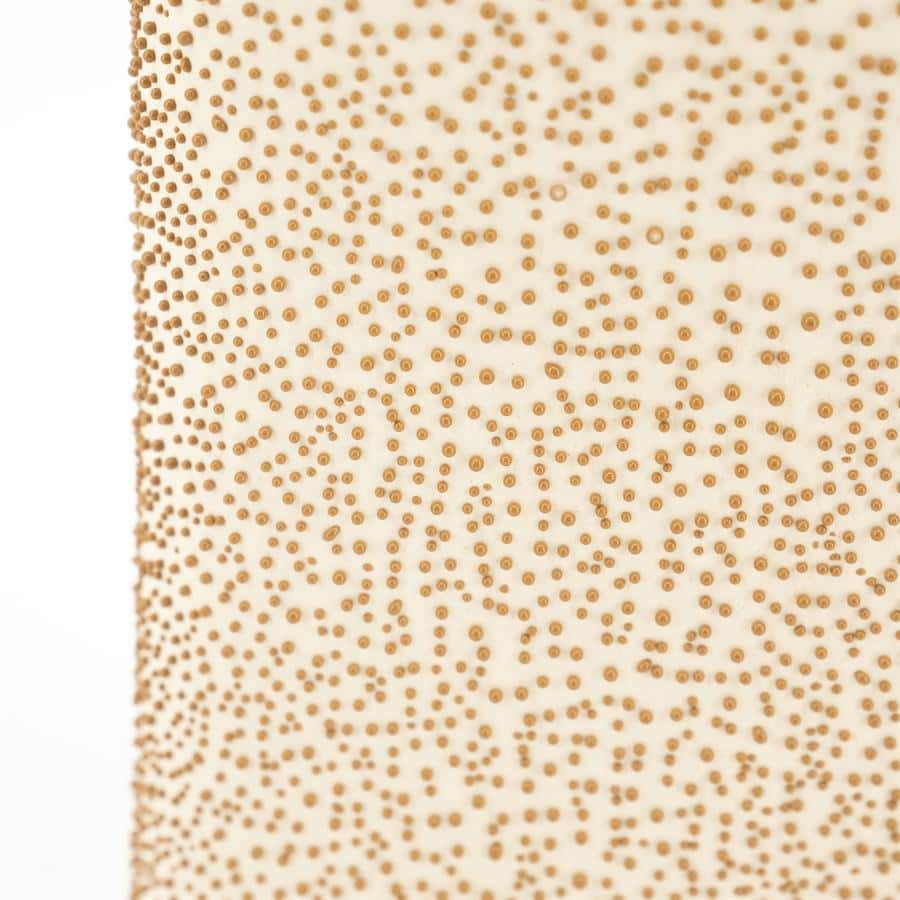 Uniek houtachtig meubel met een gedetailleerd patroon van kleine ronde textuurdetails, perfect voor moderne en stijlvolle interieuraccenten, vervaardigd door Mokana Meubelen voor kwaliteit en design.