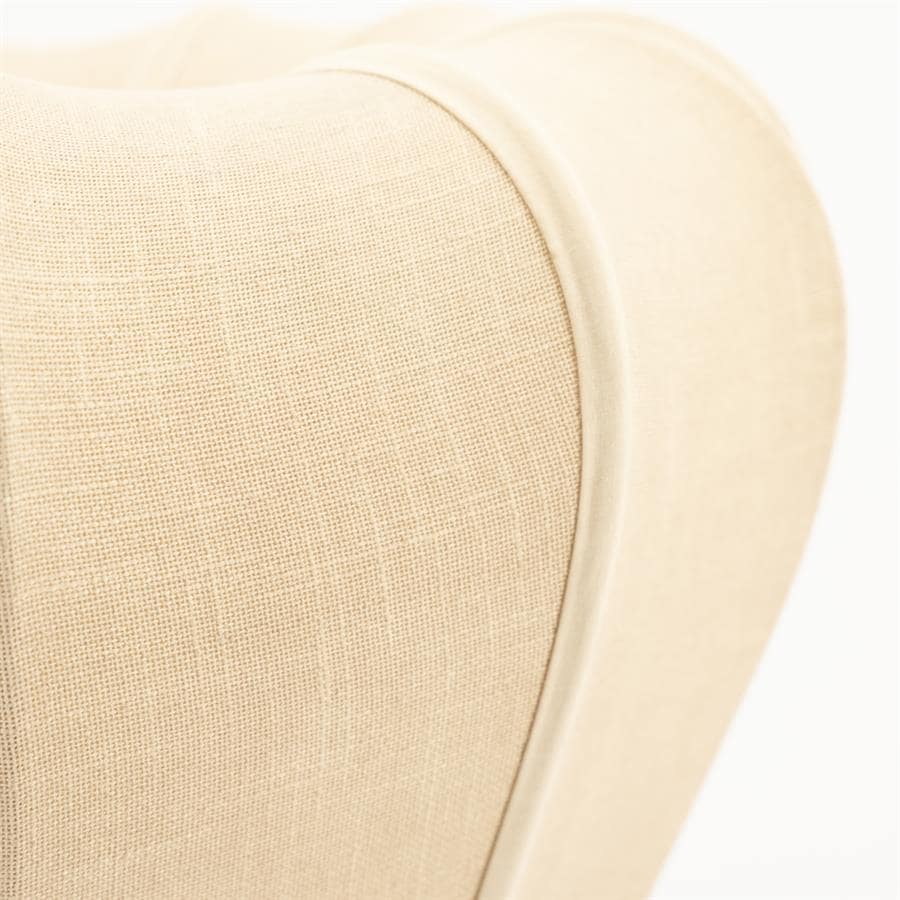 Zachte beige stoffen bekleding op een luxe, modern meubelstuk met afgeronde randen - perfect voor stijlvolle woonkamers.