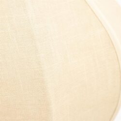 Zwevende close-up van een beige stoffen ombouw van een speaker, benadrukt de textuur en kwaliteit van de materialen voor een warme, natuurlijke uitstraling.