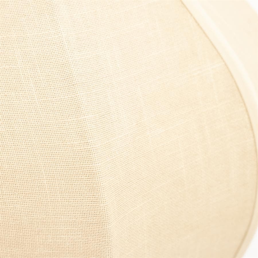 Zwevende close-up van een beige stoffen ombouw van een speaker, benadrukt de textuur en kwaliteit van de materialen voor een warme, natuurlijke uitstraling.