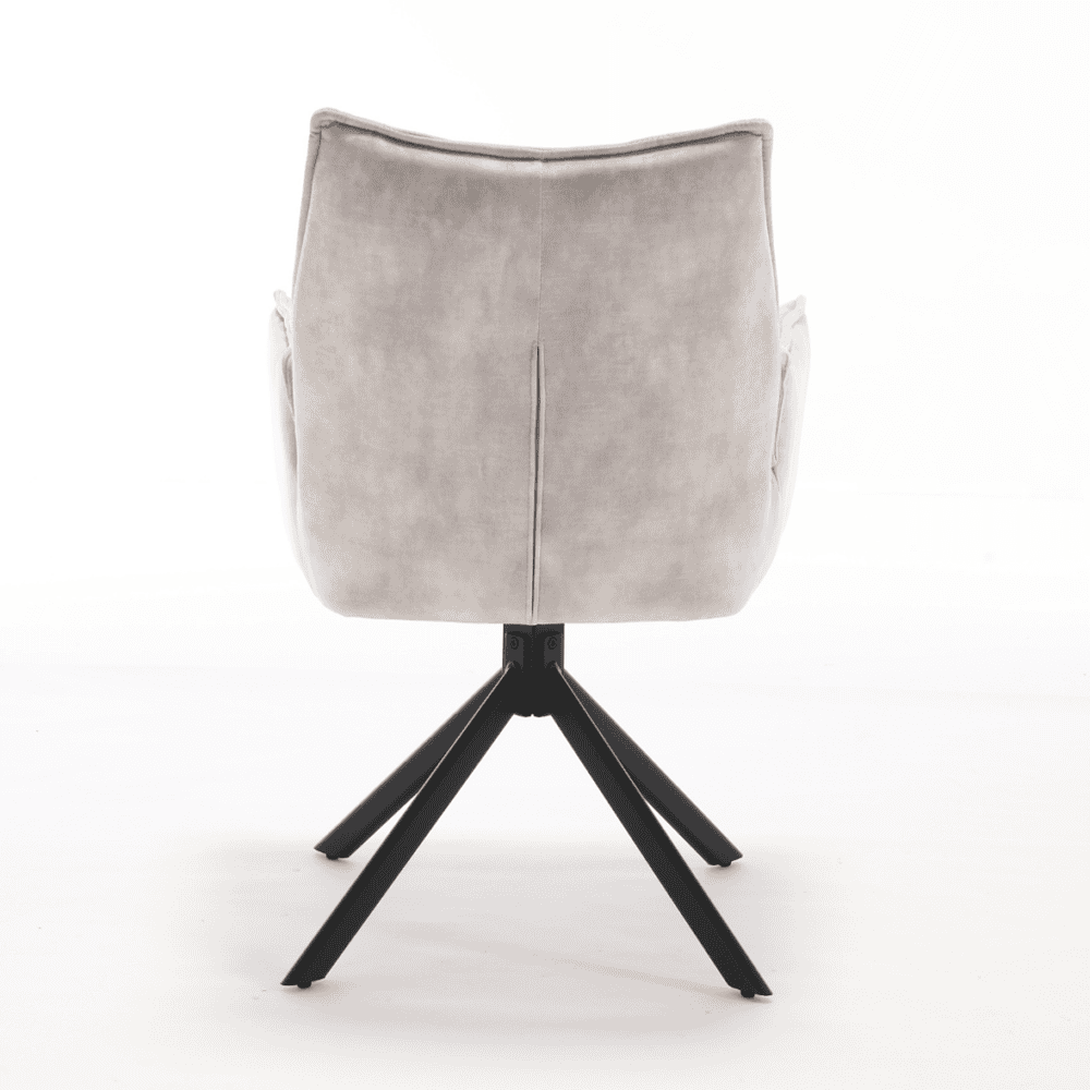 Elegant eettafelstoel met zachte bekleding en moderne zwarte houten poten, perfect voor een stijlvolle en comfortabele eetruimte.