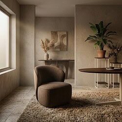Gezellige woonkamer met een comfortabele fauteuil, planten en minimalistisch interieur, perfect voor een moderne en rustige woonruimte.