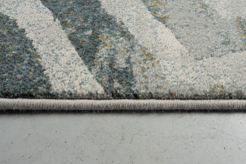 Eckdetail des Teppichs Abol 4299 mit sichtbarer Verarbeitung und Randverzierung