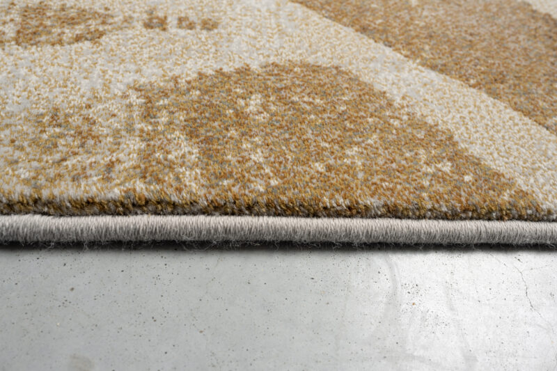 Hoekdetail van Abol 7299 karpet met afwerking en randdetail zichtbaar
