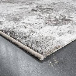 Industriële vloerkleed met verweerde uitstraling, geschikt voor moderne en vintage interieurstijlen, gemaakt van duurzaam materiaal voor een stijlvolle en praktische vloerbedekking.