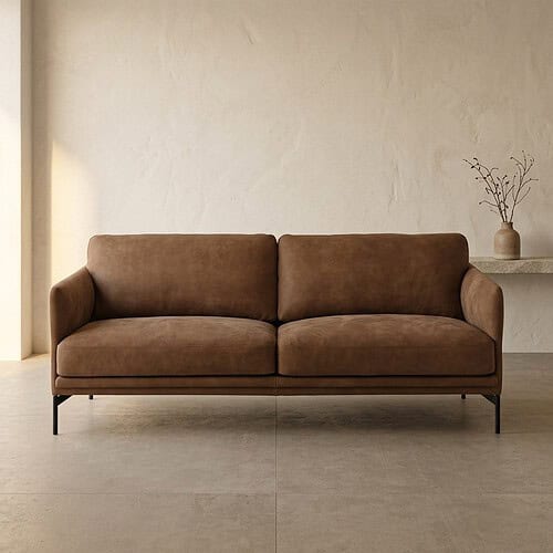 Braunes Samtsofa mit klarem Design und Metallbeinen, perfekt für ein modernes Wohnzimmer.