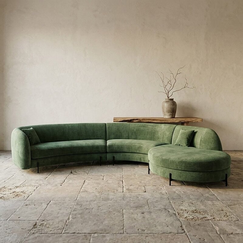 Bank met ronde poef in groene velvet, modern en comfortabel meubelstuk voor woonkamer.