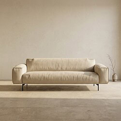 Elegante beige stoffen bank in een minimalistische woonkamer, perfect voor modern interieur en comfortabele zitervaring.