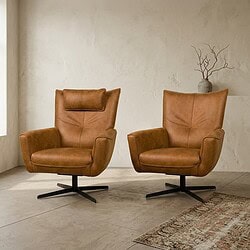 Bankenstoel met leren bekleding en moderne uitstraling Luxe leren fauteuils in een minimalistisch interieur, perfect voor een stijlvolle woonkamer of kantoorruimte.