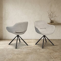 Moderne witte fauteuils met zwarte poten Twee moderne witte fauteuils met zwarte poten in een minimalistische interieursetting, perfect voor een stijlvolle woonkamer of lounge.