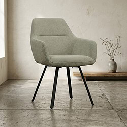 Moderne lichtgroene stoffen fauteuil met houten poten in een minimalistisch interieur, perfect voor woonkamer of kantoor.