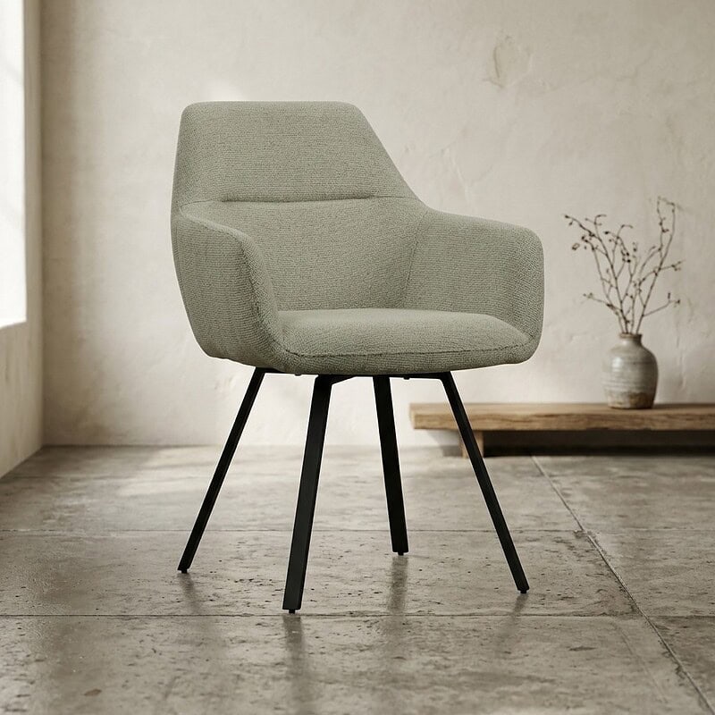 Moderne lichtgroene stoffen fauteuil met houten poten in een minimalistisch interieur, perfect voor woonkamer of kantoor.