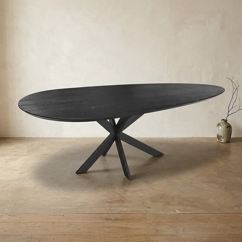 Moderne zwarte eettafel met uniek ontwerp, perfect voor stijlvolle eetkamers en moderne interieurs, gemaakt van hoogwaardig hout en afgewerkt met een matte lak.