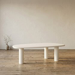 Moderne witte eettafel met uniek ovaal ontwerp en stevige poten, perfect voor een strakke en stijlvolle eetruimte.