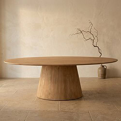 Eettafel van massief hout met ronde vorm en unieke design, perfect voor moderne interieurs. Gemaakt van hoogwaardige materialen voor duurzaamheid en stijl.