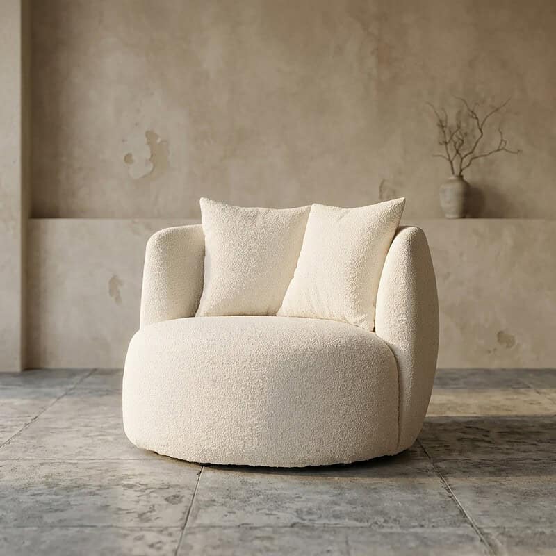 Luxuriöser weißer Sessel mit weicher Polsterung und runden Formen, perfekt für moderne und stilvolle Einrichtungen.
