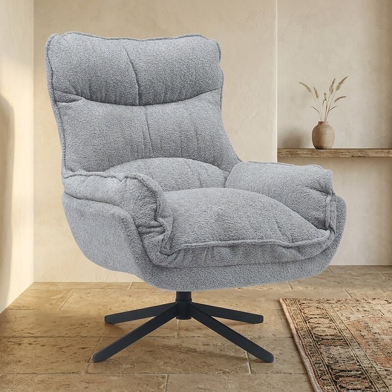 Modern Grijze Relaxfauteuil met Stijlvolle Design Moderne grijze relaxfauteuil met comfortabele bekleding en draaibare onderstel, perfect voor een stijlvolle woonkamer of kantoorruimte.
