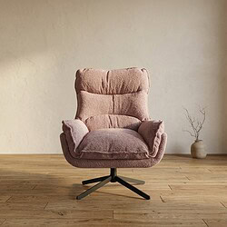 Bank fauteuil met zachte bekleding en moderne uitstraling Comfortabele roze lounge fauteuil met zachte bekleding en moderne uitstraling, geplaatst in een minimalistische woonkamer met houten vloer en een decoratieve vaas op de achtergrond.