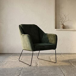 Moderne groene fauteuil met metalen onderstel, perfect voor een stijlvolle en comfortabele zithoek.