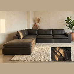 Luxe zwarte leren loungebank van Mokana meubelen, perfect voor moderne woonkamers, met comfortabele zitplaatsen en stijlvolle uitstraling.