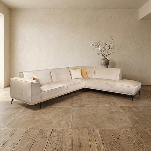 Moderne witte loungebank van Mokana in een minimalistische woonkamer met natuurlijke decoratie en houten vloer. Perfect voor stijlvolle en comfortabele zithoek.