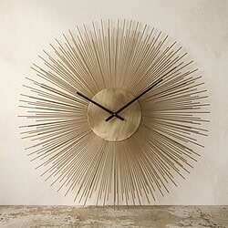 Moderne Mokana wandklok met stralende spijlen en minimalistisch ontwerp, perfect voor stijlvolle interieurdecoratie.