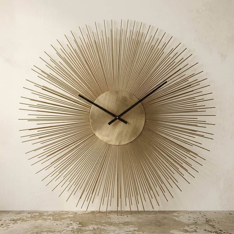 Moderne Mokana wandklok met stralende spijlen en minimalistisch ontwerp, perfect voor stijlvolle interieurdecoratie.