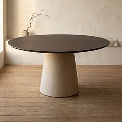 Moderne eettafel van Mokana Meubelen met een ronde, donkerhouten blad en een unieke, conische basis, perfect voor een stijlvolle eetkamer.