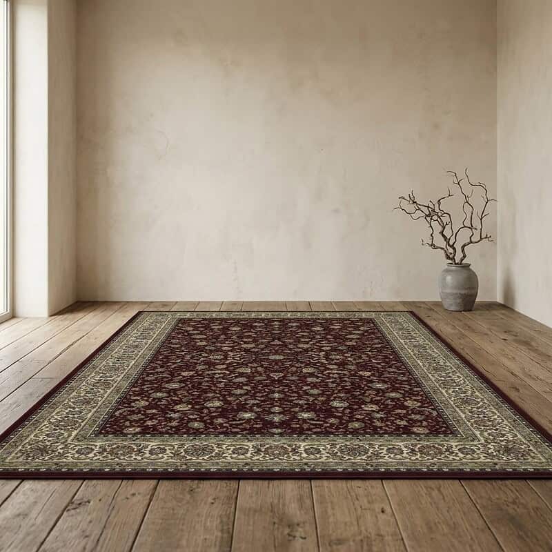 Ein Vintage-Teppich im Wohnzimmer mit minimalistischer Dekoration und einem Zweig in einer Vase – ein stimmungsvolles und elegantes Interieur.