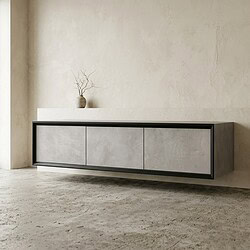 Modern zwart en grijs dressoir met strakke lijnen in een minimalistisch interieur, gecombineerd met een decoratieve vaas met takken.