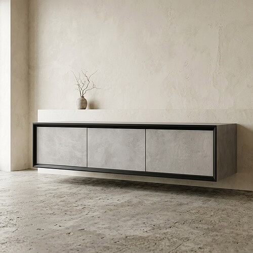 Modern zwart en grijs dressoir met strakke lijnen in een minimalistisch interieur, gecombineerd met een decoratieve vaas met takken.